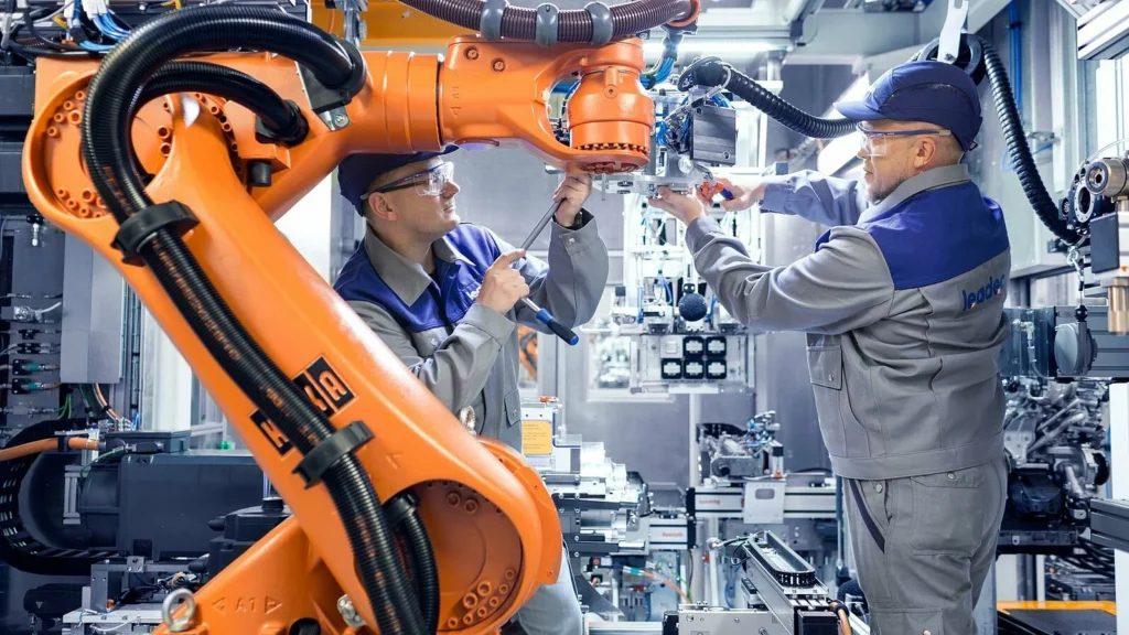 Technician performing preventive maintenance on industrial machinery to ensure optimal performance